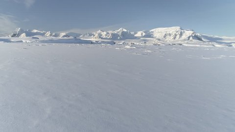 Snow Covered Antarctic Surface Timelapse Aerial View Flight. South Pole Ice Landscape. Winter Frozen Ground Continent Snowy Frost Rock Epic Drone Fly Footage Shot in 4K (UHD)