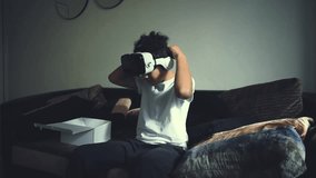?ool african american boy wore VR goggles and hit the virtual reality. The child wore a virtual reality glasses. Fun for children a mixed boy wearing VR glasses in his house. Virtual  life. - Powered by Shutterstock - Get 15% off with code: PIKWIZARD15
