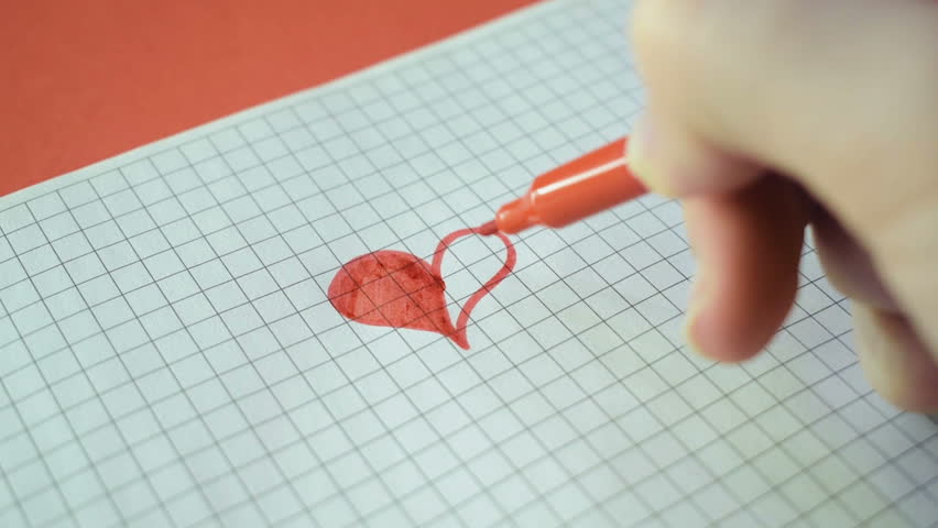 A red marker draw a heart. Valentine