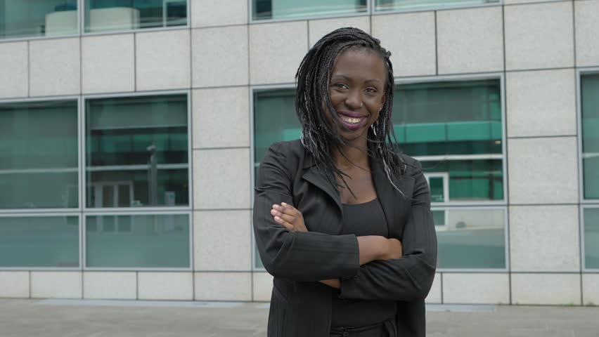 Confident succesful young black african business woman crossing her arms