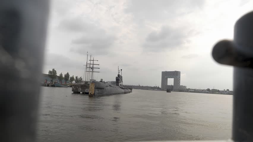 A shot from the ferry showing the rusty submarine at the NDSM and in the background the famous architecture prize winning building the Pontsteiger.