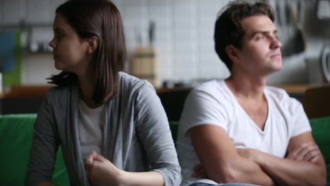 Angry offended wife frustrated with distrust stubborn husband avoiding talk, stressed girlfriend annoyed by ignoring boyfriend after fight dispute at home, misunderstandings in couple relationships