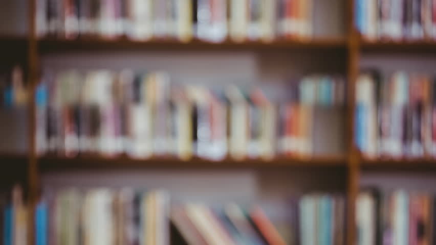 Digitally generated animation of business symbols against a library background