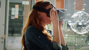 Digital composite of woman using virtual reality in office. Woman holding vr glasses while looking at animated globe with connections.