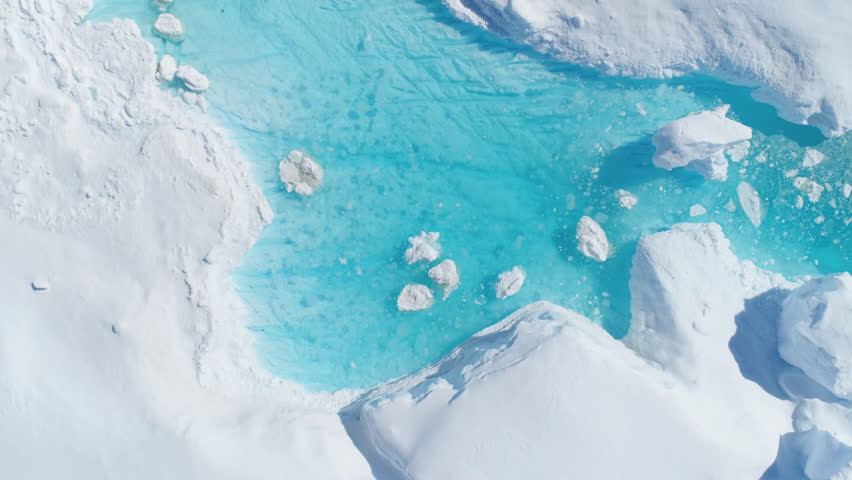 Antarcica Iceberg Turquoise River Top Down View. Nature Lake with Blue Water and Broken Ice Flow. Ecology, Melting Ice, Climate Change and Global Warming Concept Aerial Drone Shot Footage 4K (UHD) Royalty-Free Stock Footage #1022388232