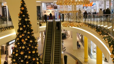 Nuremberg, Germany - December 3, 2018: New Year and Christmas decor in the shopping center mall. Christmas garlands lights and balls of gold color