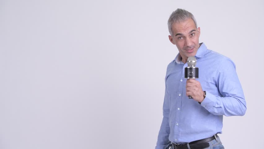 Happy handsome Persian businessman as newscaster