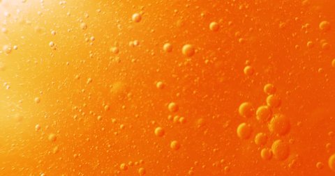 Extreme macro of bubbles in orange gel