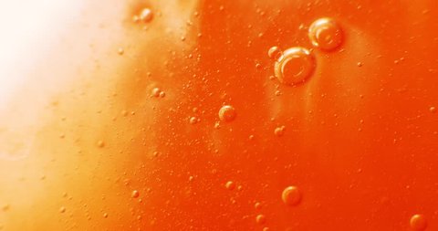 Extreme macro of bubbles in orange gel 