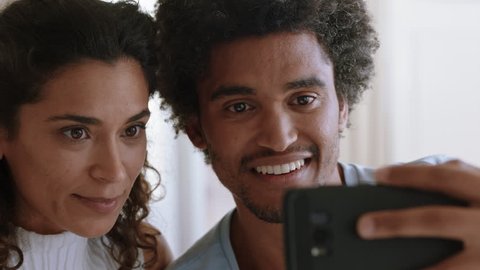 happy couple video chatting on smartphone beautiful woman showing engagement ring enjoying romantic celebration