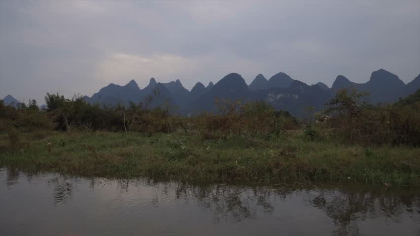 Brilliant parallax view of mountains from the Li River in Guilin.