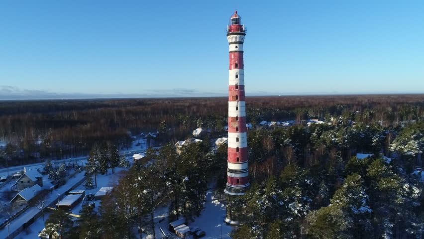 Lighthouse in winter. Aerial video shooting