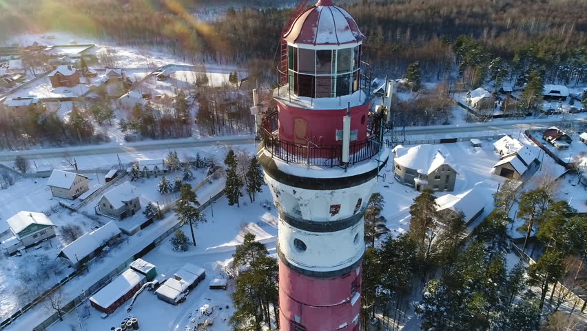 Lighthouse in winter. Aerial video shooting