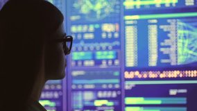 The businesswoman in glasses looking to the big display - Powered by Shutterstock - Get 15% off with code: PIKWIZARD15