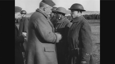CIRCA 1940s - Black soldiers Needham Roberts and Henry Johnson receive medals for distinguished service during World War 1 in France.