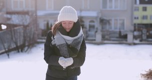 Happy Girl throwing snow and spin with smile face. 4K Footage - Video