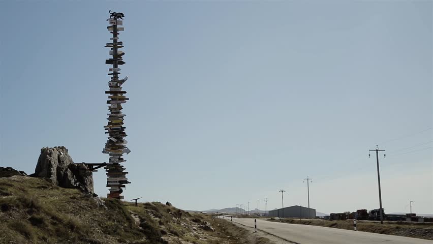 Totem Pole with Distances to World Destinations, Erected by British Troops after Falklands Conflict, near Stanley, Falkland Islands (Islas Malvinas). 