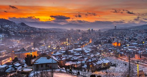 Sarajevo skyline aerial view from night to day timelapse at winter Bosnia and Herzegovina snow in sarajevo city timelapse. View of Sarajevo old town and city hall.