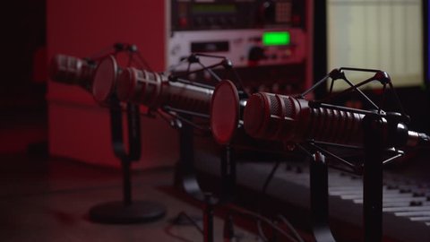Pro microphones hit by red lighting