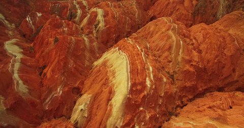 Aerial above view of colorful Danxia rock formations of The Zhangye National Geopark in Gansu province of China, 4k drone nature landscape footage