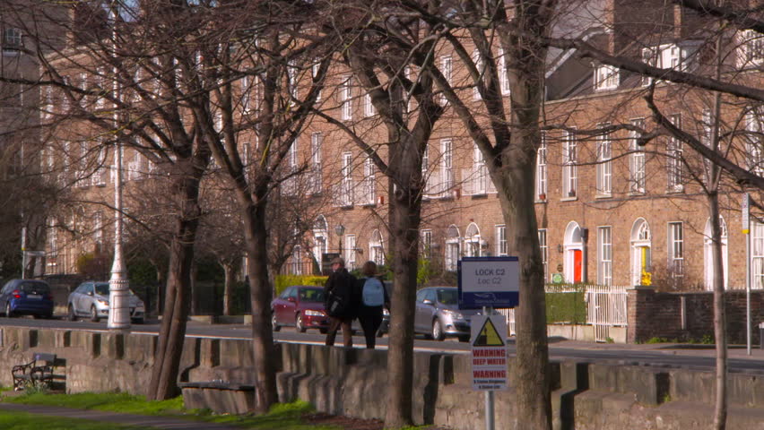 Pan Right to Left: Couple Walks in the City of Dublin Ireland