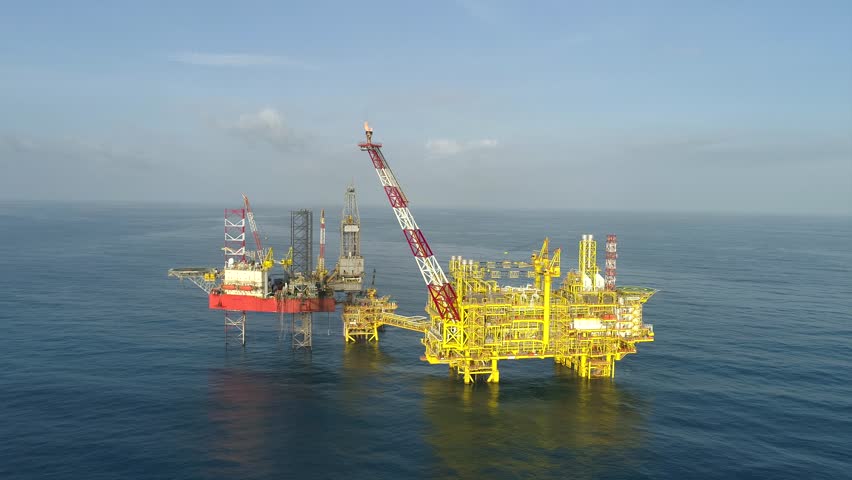 KELANTAN, MALAYSIA - JANUARY 15, 2019: Offshore jack-up drilling rig and gas production platform in Kelantan waters, Malaysia. | Shutterstock HD Video #1022483752