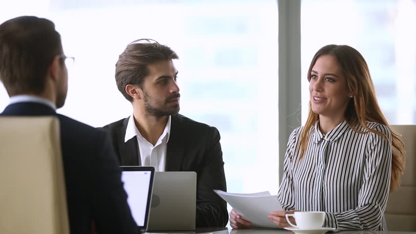 Businesswoman handshaking new male partner make deal finish group negotiation, satisfied executives conclude contract agreement shake hand thanking for successful teamwork, hr hiring at job interview Royalty-Free Stock Footage #1022497294