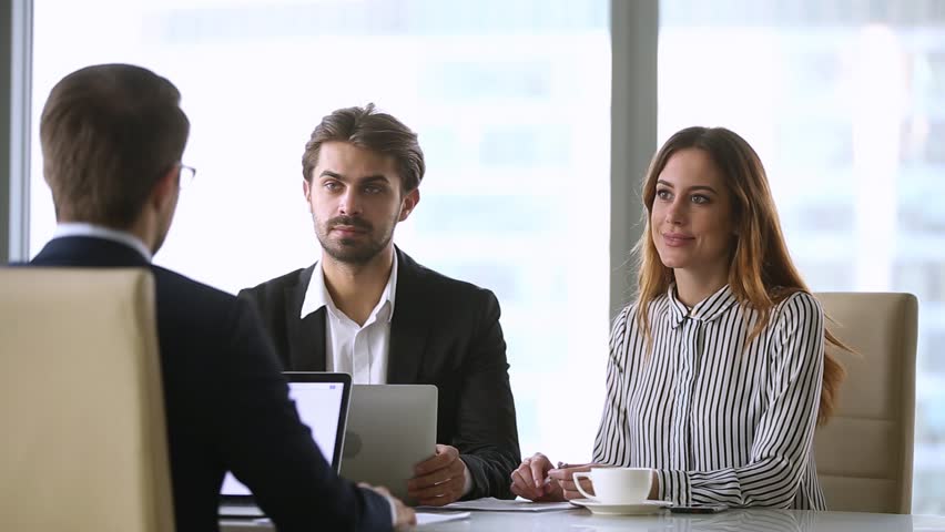Business partners closing partnership collaboration deal with handshake at group negotiations, executive businessmen shake hands at corporate office meeting thanking for successful teamwork concept  Royalty-Free Stock Footage #1022497297
