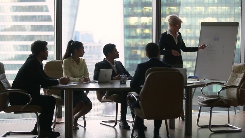 Female executive leader coach presenter giving lecture presentation in modern office boardroom for corporate employees group, speaker mentor explaining training professional team at business seminar Royalty-Free Stock Footage #1022497318