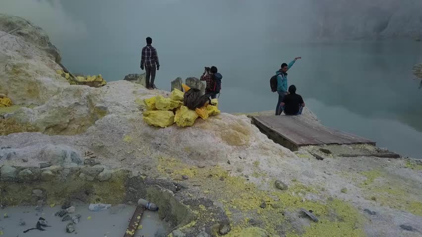Panoramic view from the Ijen crater. Sulfur smoke and volcanic lake. Jawa, Indonesia.