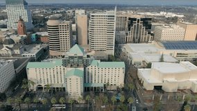 Aerial: flying above the city buildings of downtown Sacramento, California, USA