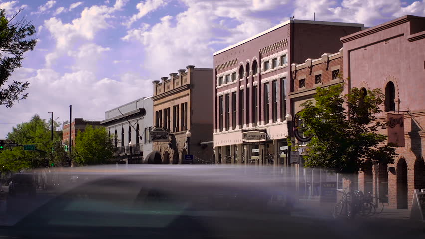 Time lapse of busy street in downtown Boise, Idaho with traffic rushing by creating streak in long exposure