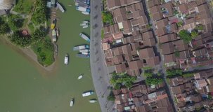 Aerial view panorama of Hoi An old town or Hoian ancient town. Royalty high-quality free stock video footage top view pier dock river and boat traffic Hoian. Hoi An the most popular travel in Vietnam