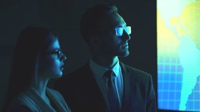 The business man and a woman in glasses discussing near the display - Powered by Shutterstock - Get 15% off with code: PIKWIZARD15