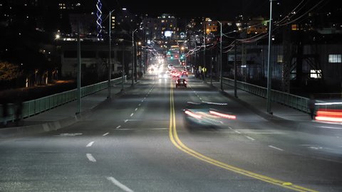Busy City Street Car Light Streak Trails with Far Vanishing Point of Focus