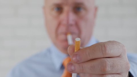 Businessperson Image Smoking and Offering a Cigarette to Another Person