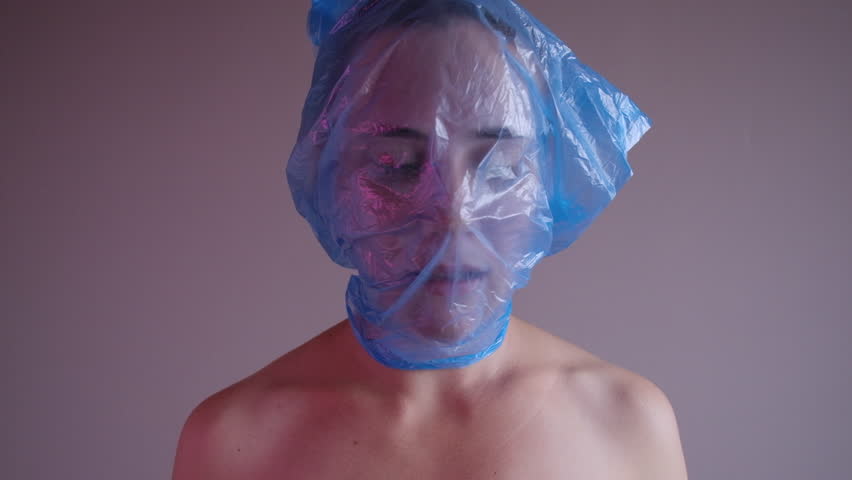 Woman Plastic Bag On Her Head : vidéo de stock (100 % libre de droit) 10225...