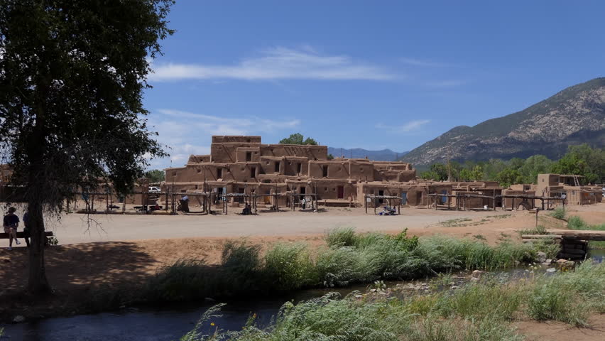 Taos Pueblo, New Mexico, United States of America. View of small Native American village in the Southwest US inhabited by Tiwa Indians. National Historic Landmark and UNESCO Heritage Site