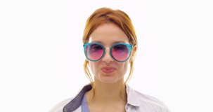 Beautiful happy fun young redhead hair cool adult woman smiling and using sunglasses.Person action.People video portrait isolated on white background.Medium shot.4k video