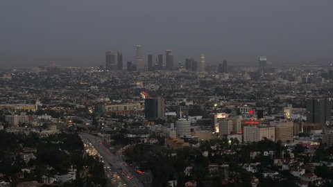 LOS ANGELES, CA, USA - APR 15.2015: Skyline of Los Angeles at twilight view from Hollywood Hills downtown and 101 freeway