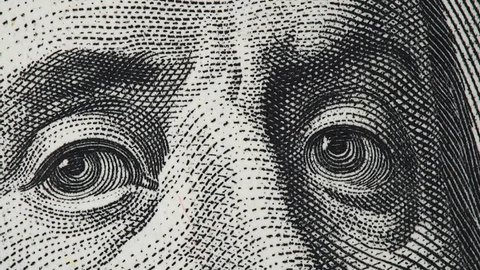 Benjamin Franklin on US 100 dollar bill extreme macro slow rotating. 