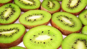 Kiwi sliced kiwis background closeup video