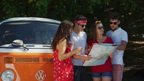 Young tourists looking at a map.