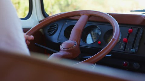 Dashboard and steering wheel of a campervan.