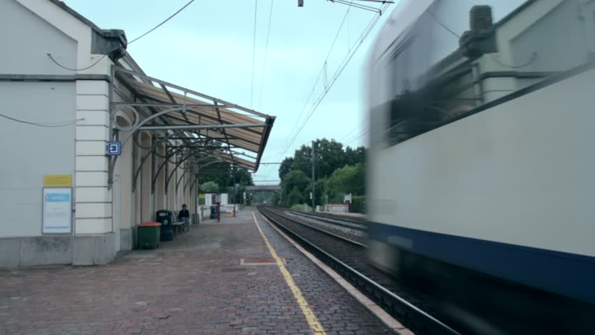 train passing in small Belgium station