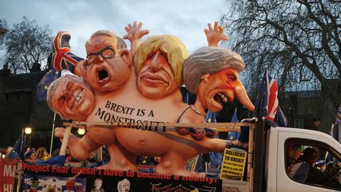 LONDON, circa 2019 - Close-up shot of a Pro-EU float representing Theresa May, Boris Johnson, Michael Gove and Nigel Farage in a bid to stop BREXIT. With ambient sound.