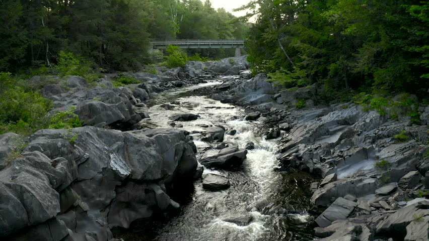 Aerial shot over Piscataquis River at Barrel Falls.