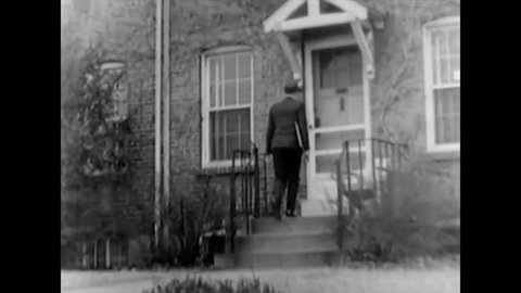 CIRCA 1940s - A man with the census bureau visits a woman at her house in the 1940s