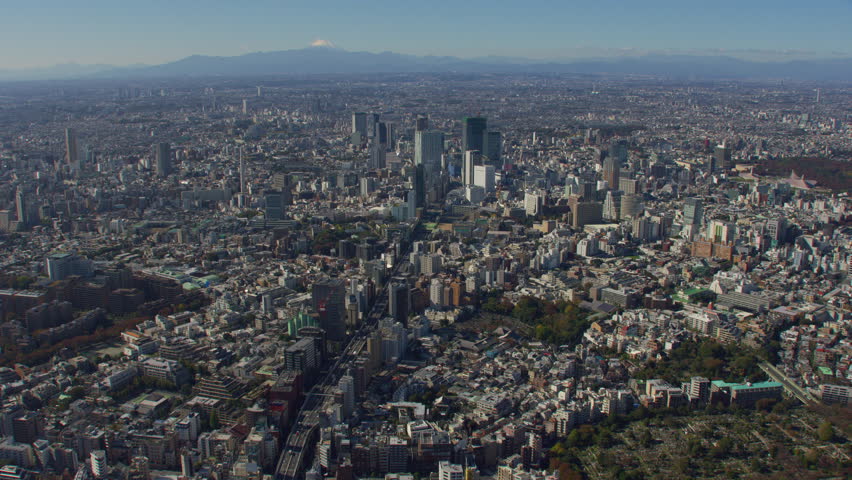 Tokyo, Japan circa-2018. Flying over city of Tokyo with Mt. Fuji in distance. Shot from helicopter with RED camera. | Shutterstock HD Video #1022610553