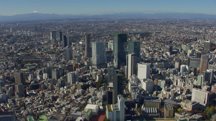 Tokyo, Japan circa-2018. Flying over city of Tokyo with Mt. Fuji in distance. Shot from helicopter with RED camera.